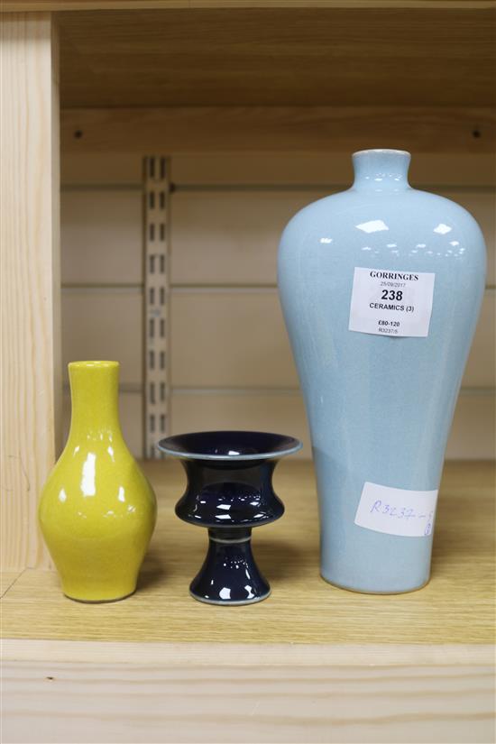 A Chinese blue-glazed stem cup, a yellow vase and a claire de lune glazed meiping